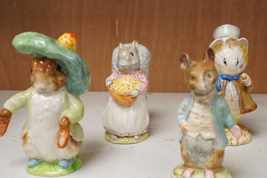 A collection of thirteen Beatrix Potter character figures, stamped with a gold stamp F Warne and Co Ltd, Beswick England, largest 12cm high